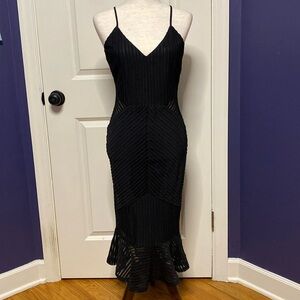 Lulu’s size small black body con dress, mesh side detail, mermaid tail